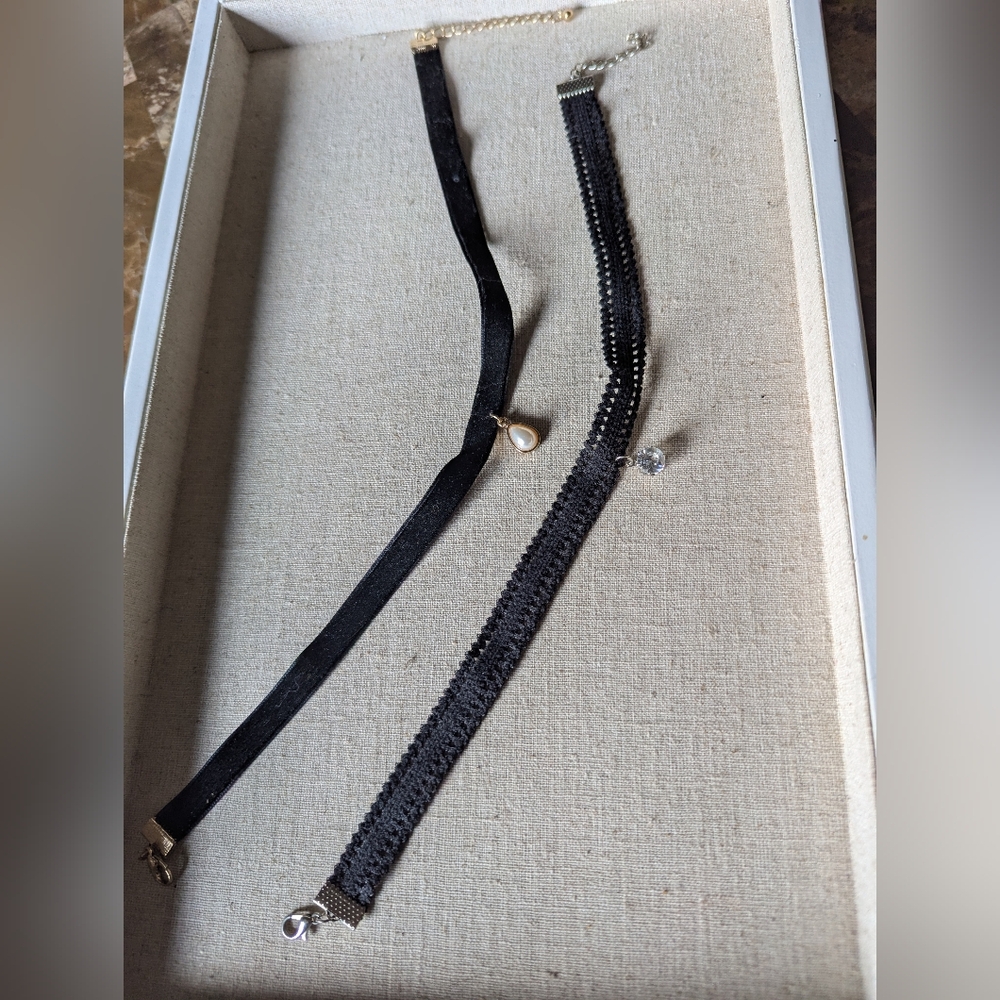 Two choker style necklaces, black